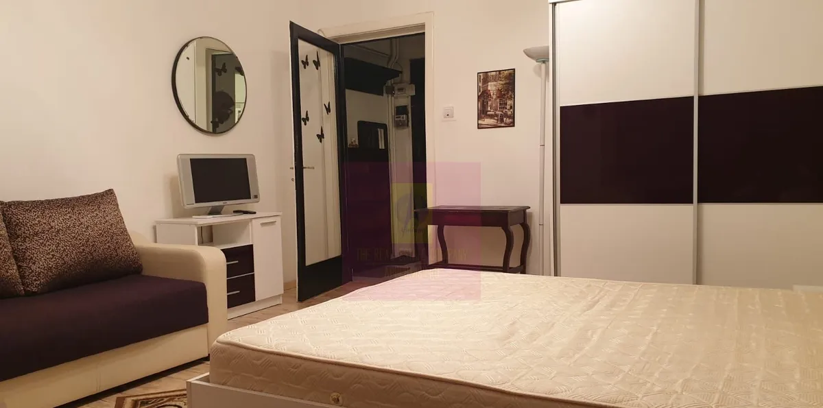 investitie Garsoniera ultracentrala Piata Romana ase