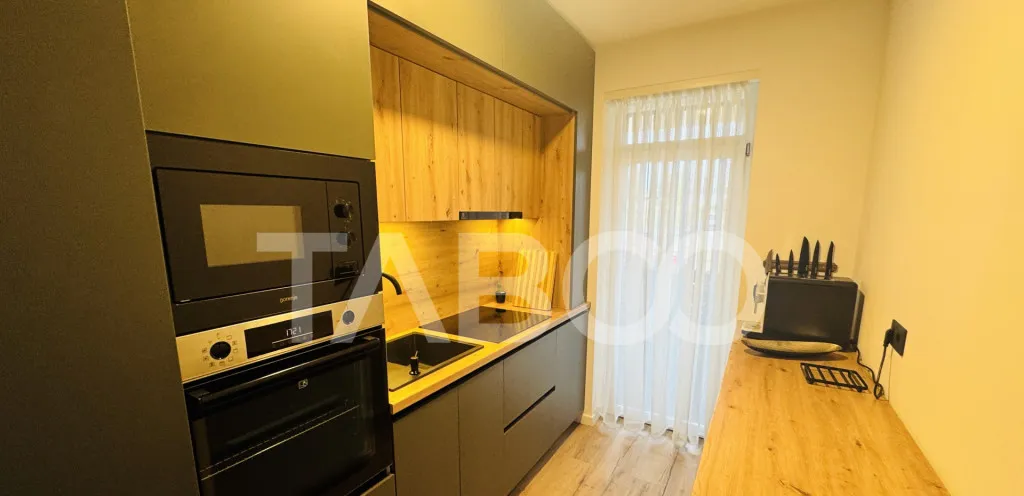 Apartament modern 63mpu 3 camere 2 bai 2 parcari de vanzare