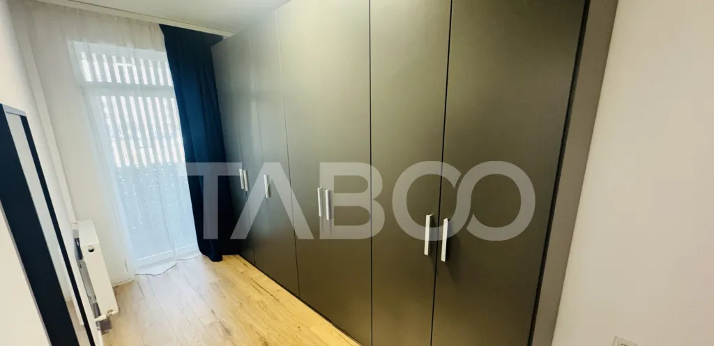 Apartament modern 63mpu 3 camere 2 bai 2 parcari de vanzare