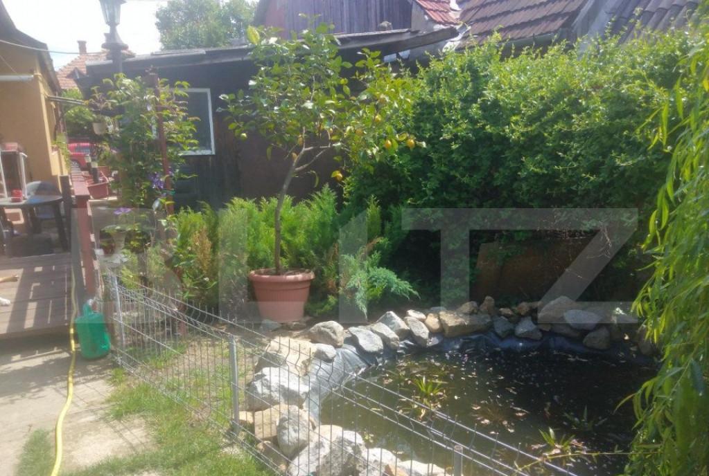 Casa cu 4 camere 119 mp utili 660 mp teren zona Dambul